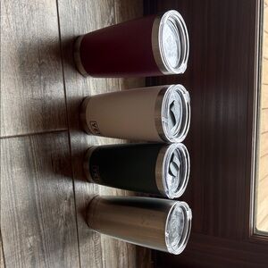 Yeti Stainless Travel Tumblers in Burgundy, White, Forrest Green, and Stainless